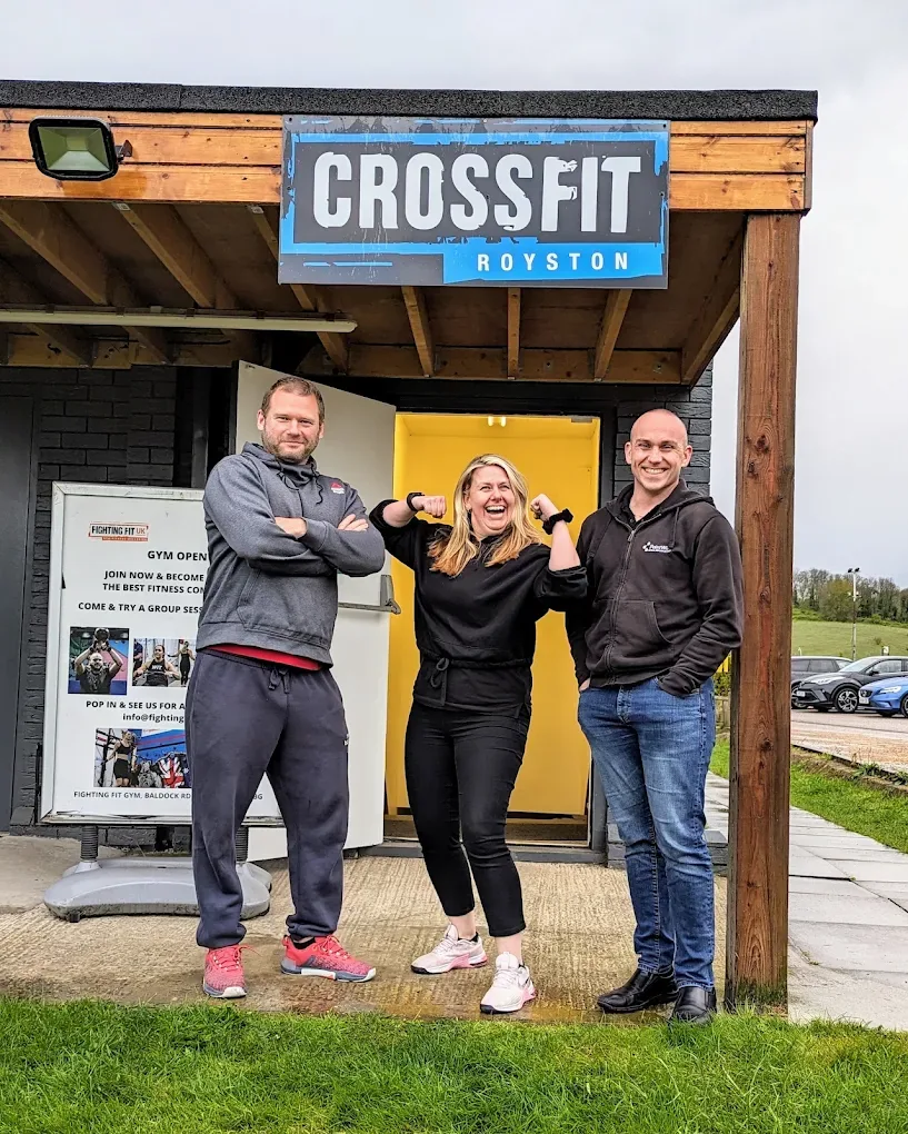 Three members of the Royston Health Fitness team outside CrossFit Royston