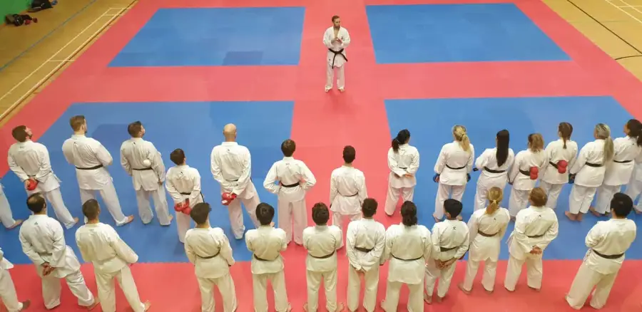 An instructor leading a class at United Karate Association
