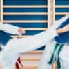 Two martial arts students practice in the dojo after their club gained their membership by following 2026 martial arts trends.