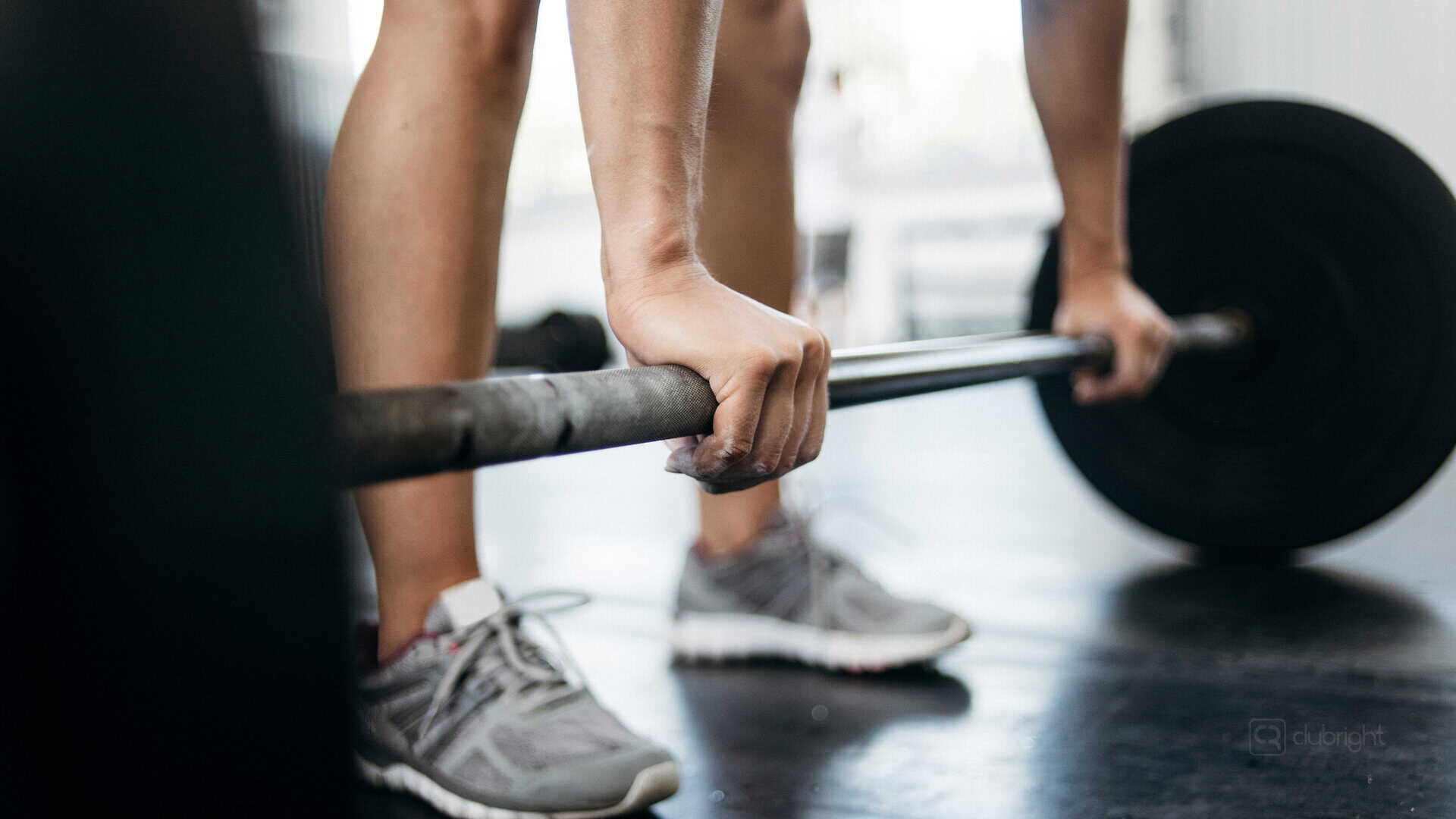 Gym owner prepares to deadlift after reflecting on the skills they’ve learned over the years.