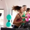 Gym members running on treadmills after a club successfully used club management software to grow while maintaining high-quality instruction and member satisfaction.