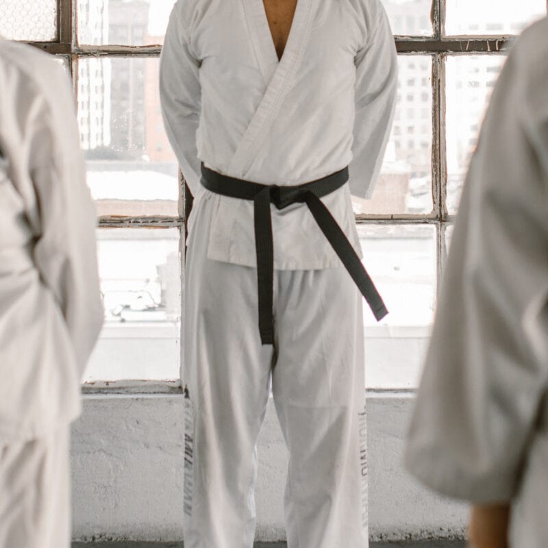 Martial Arts instructor stands in front of a class of new students following a successful branding campaign.