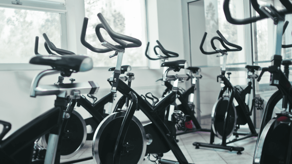 Spin bikes are lined up ready for a busy day of classes at a popular health club.