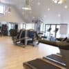 A gym sits empty during off-peak hours, prompting the gym owner to look at revenue-boosting strategies.