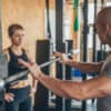 Gym owner runs a personal training session with their client before tackling a mountain of admin tasks.