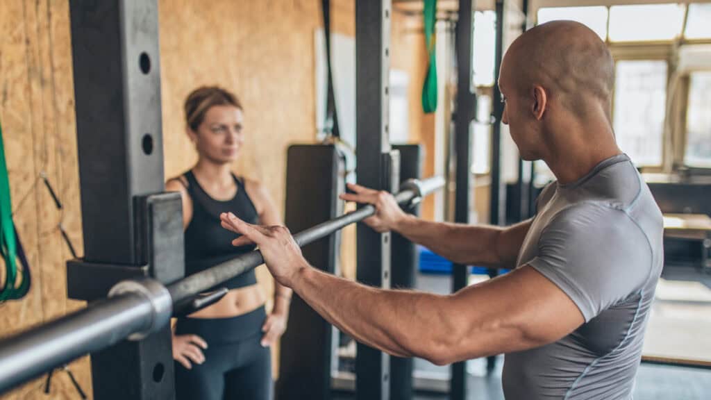 Gym owner runs a personal training session with their client before tackling a mountain of admin tasks.