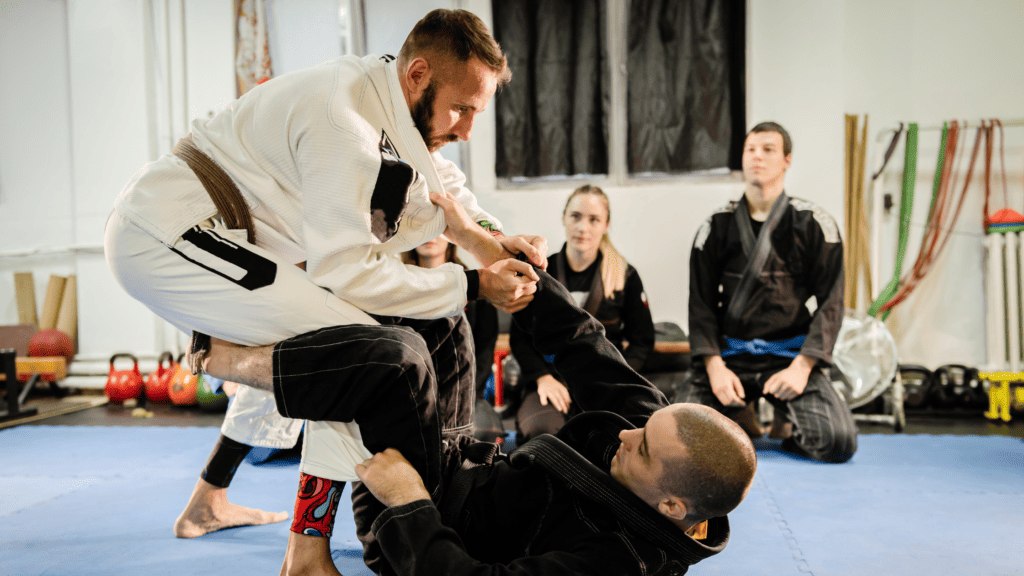 Martial arts instructor teaches jujitsu class after successfully streamlining their school’s operations.