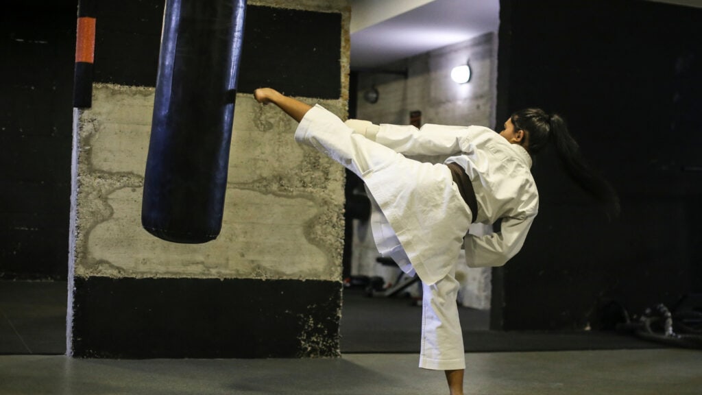 Karate student warms up at an independent martial arts club.