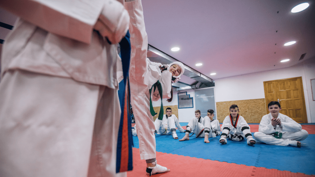 Long-time students participate in a belt-grading exercise at a martial arts club.